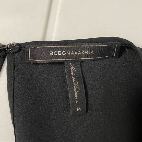 BCBG MAXAZRIA solid black sleeveless blouse ruffled assymmetric hem‎ sz medium - Picture 2 of 9